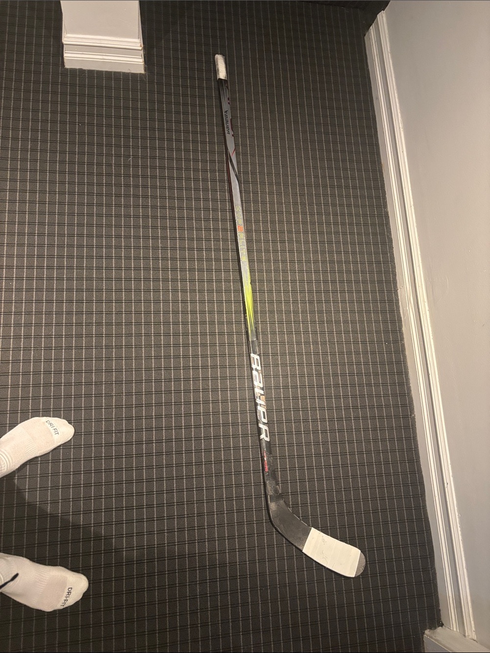Bauer Hockey Stick in Black with White Tape and Yellow Accent